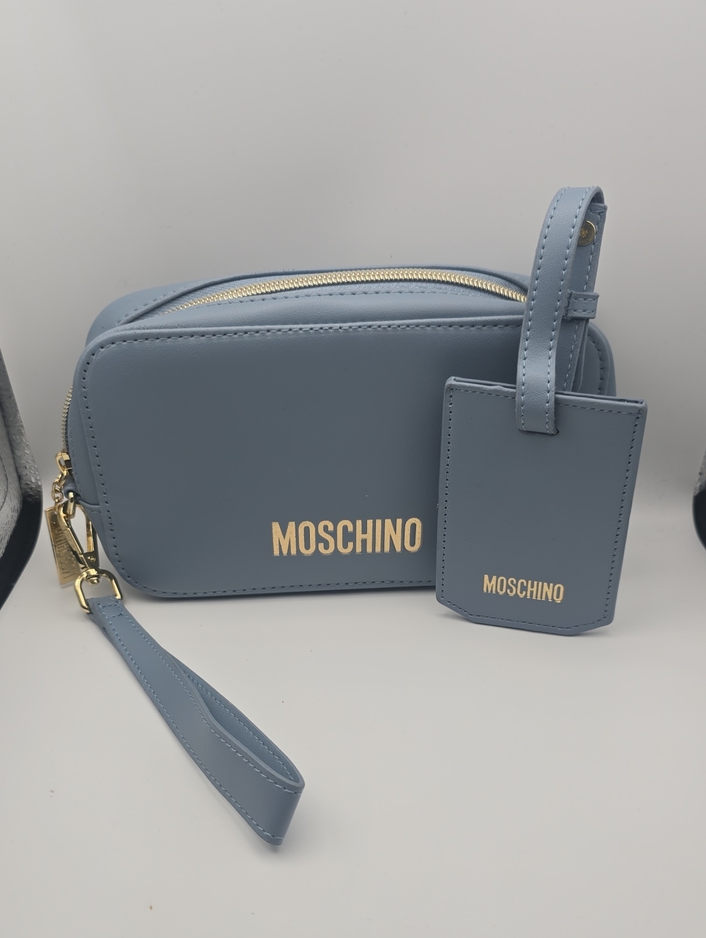 Moschino China Airlines Baby Blue W Gold Hardware Wristlet W Luggage Tag (NWOT)✨